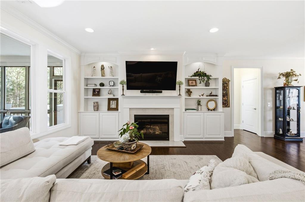 91 Bellwind Lane Dallas, GA 30132 - Photo 8 of 44 a living room with furniture a flat screen tv and a fireplace