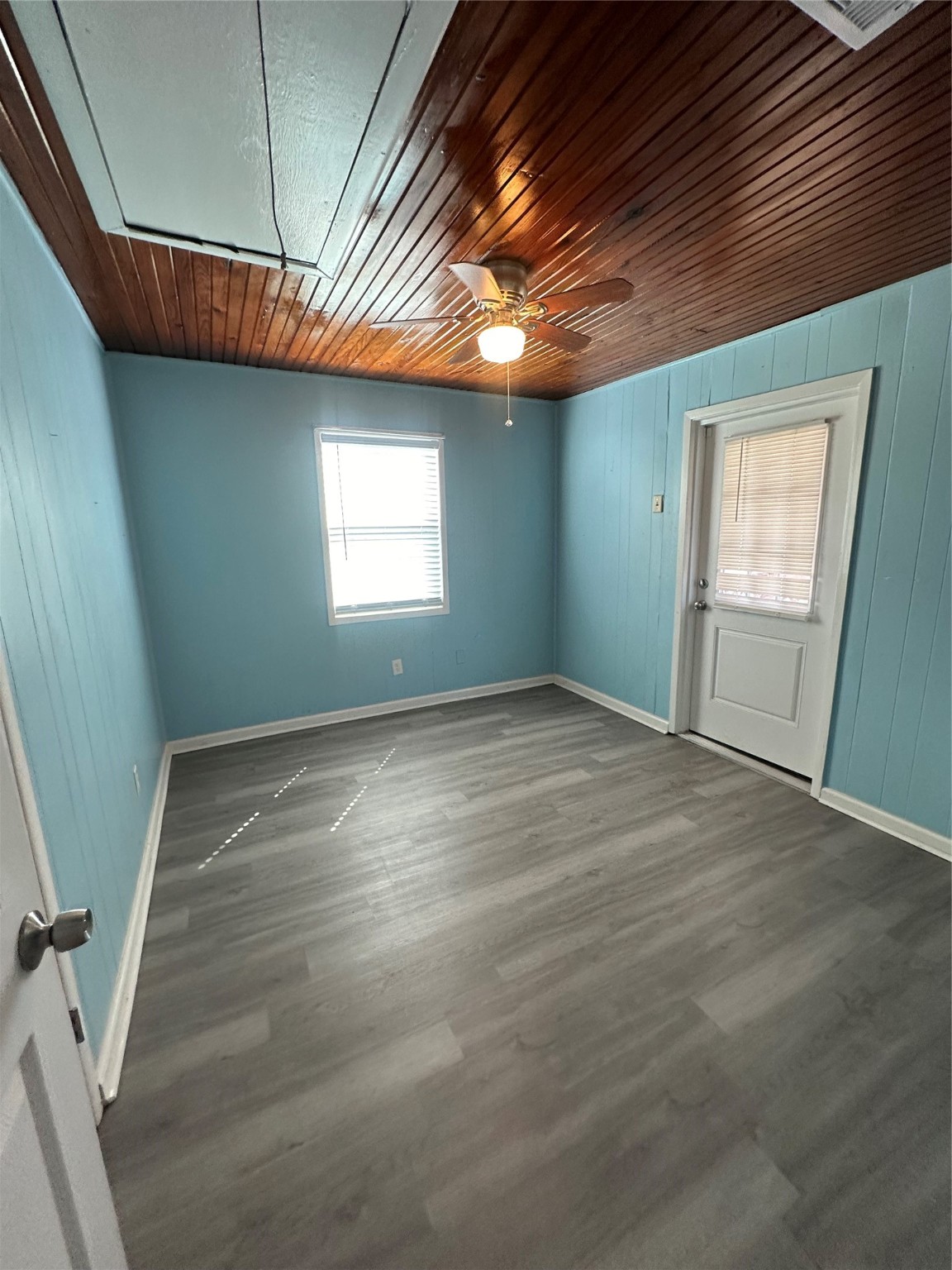 236 3rd Street San Leon, TX 77539 - Photo 14 of 18 an empty room with wooden floor and windows
