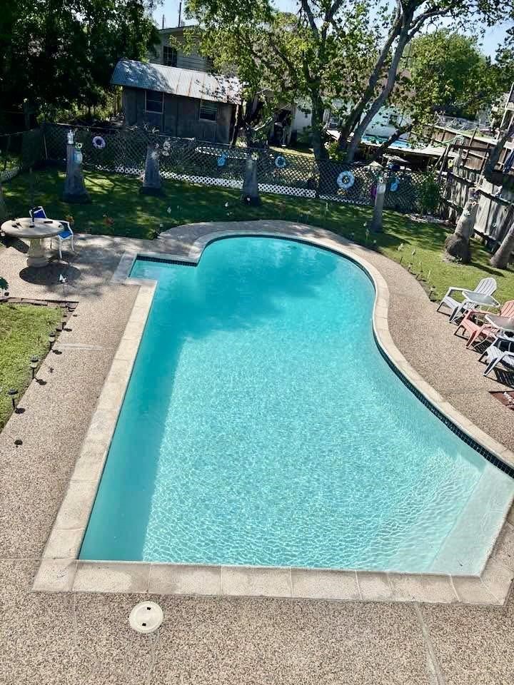 236 3rd Street San Leon, TX 77539 - Photo 2 of 18 a view of a swimming pool with a patio