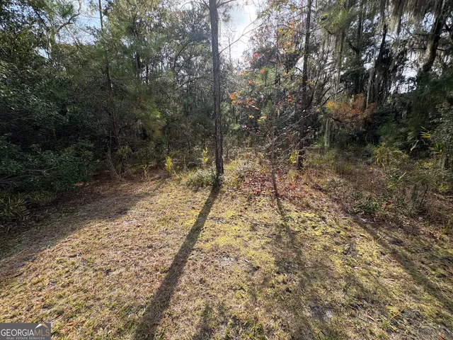 a view of an empty room and a window