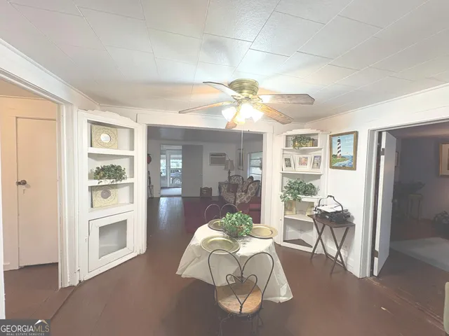 a kitchen with a sink cabinets and window