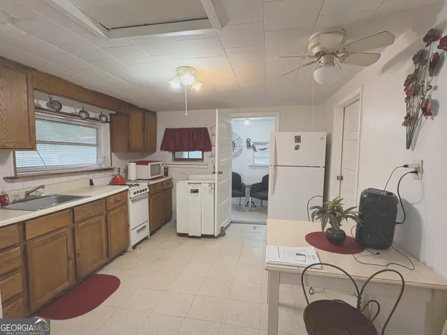 a bathroom with a toilet a sink and bathtub