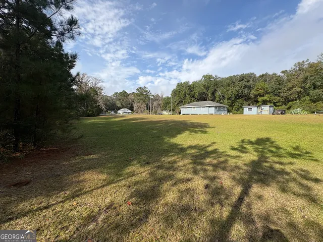 a view of a yard with an outdoor space
