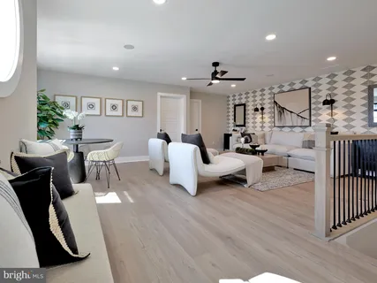 a bedroom with a bed and ceiling fan