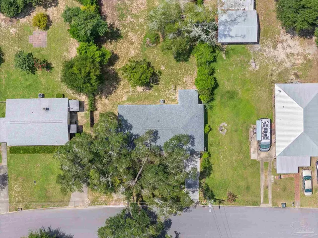 a view of a swimming pool with outdoor seating