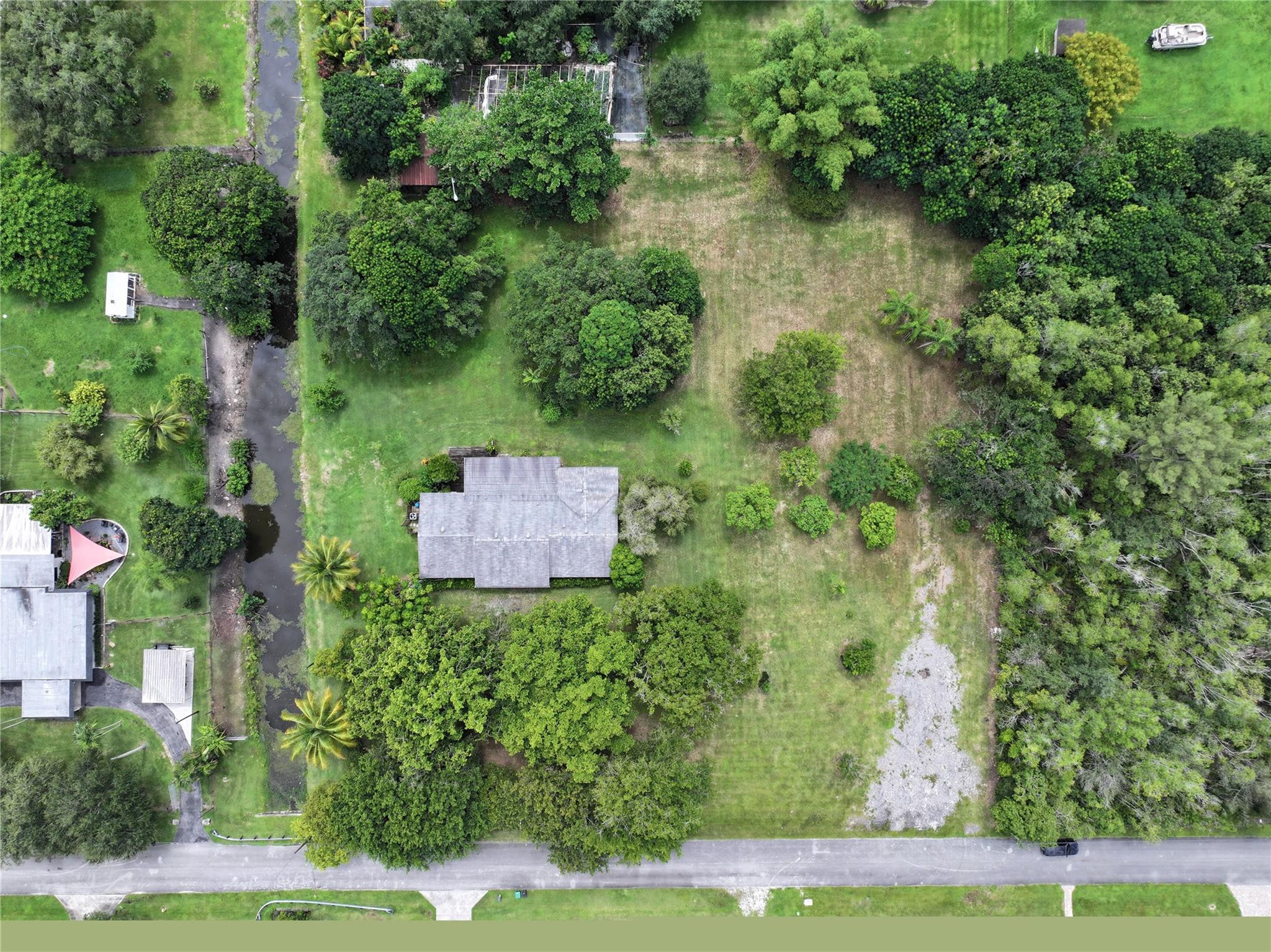 18100 Southwest 55th Street Southwest Ranches, FL 33331 - Photo 1 of 16 an aerial view of a house with a yard