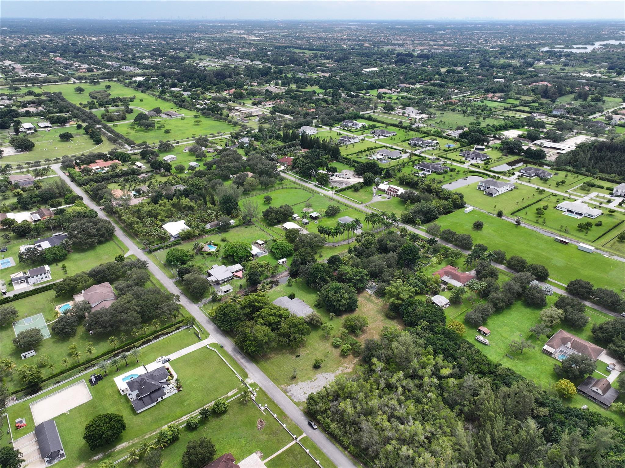 18100 Southwest 55th Street Southwest Ranches, FL 33331 - Photo 12 of 16 an aerial view of residential houses with outdoor space and trees