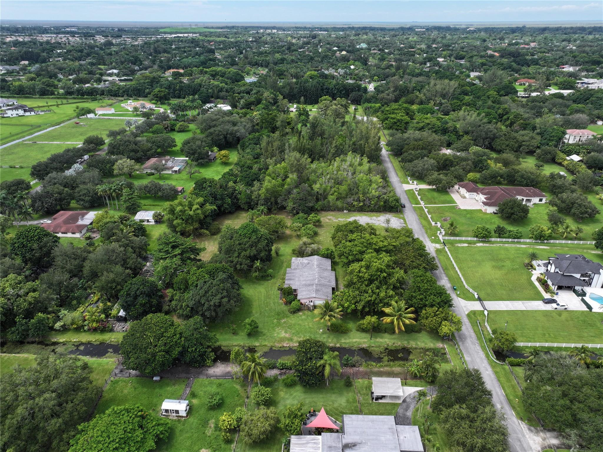 18100 Southwest 55th Street Southwest Ranches, FL 33331 - Photo 5 of 16 an aerial view of residential houses with outdoor space and street view