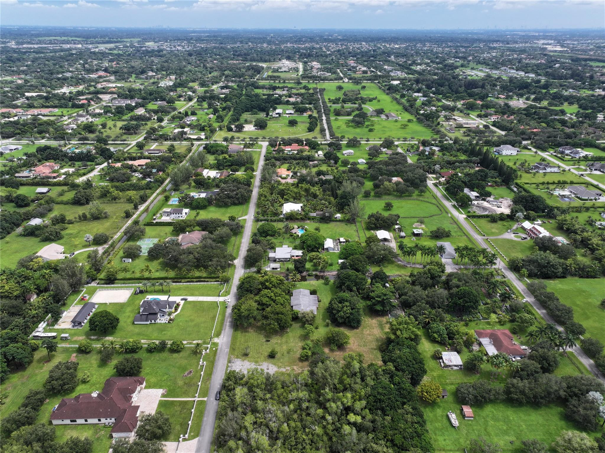 18100 Southwest 55th Street Southwest Ranches, FL 33331 - Photo 6 of 16 an aerial view of residential houses with outdoor space and trees