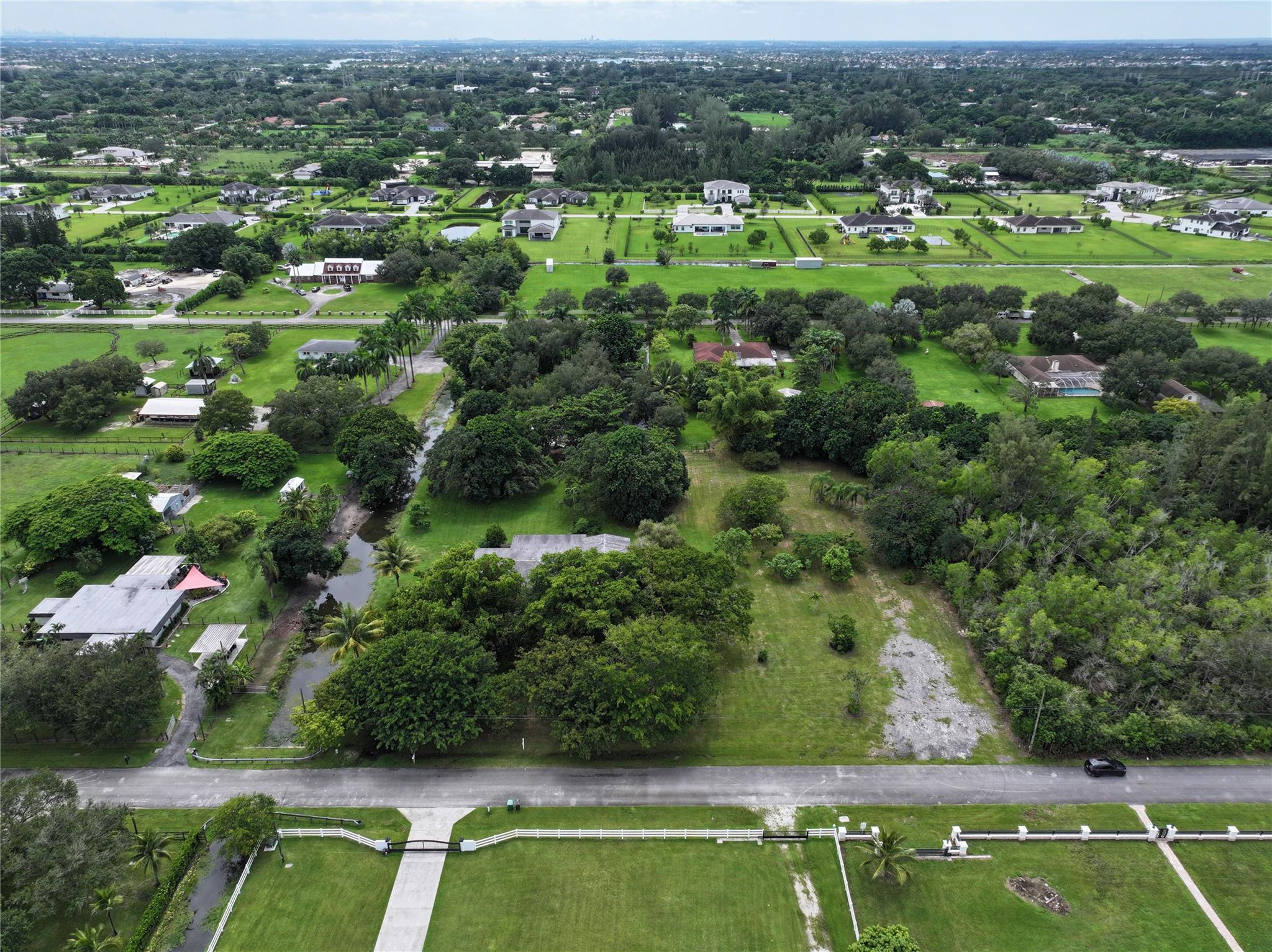 18100 Southwest 55th Street Southwest Ranches, FL 33331 - Photo 10 of 16 an aerial view of residential houses with outdoor space and trees