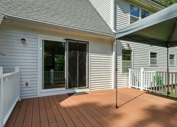 a view of backyard with large windows