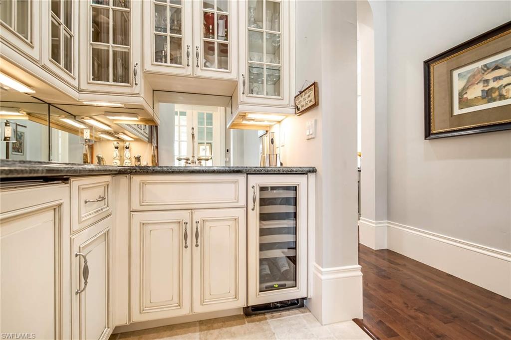 2220 Miramonte Court Naples, FL 34105 - Photo 11 of 35 a kitchen with a cabinets and a stove