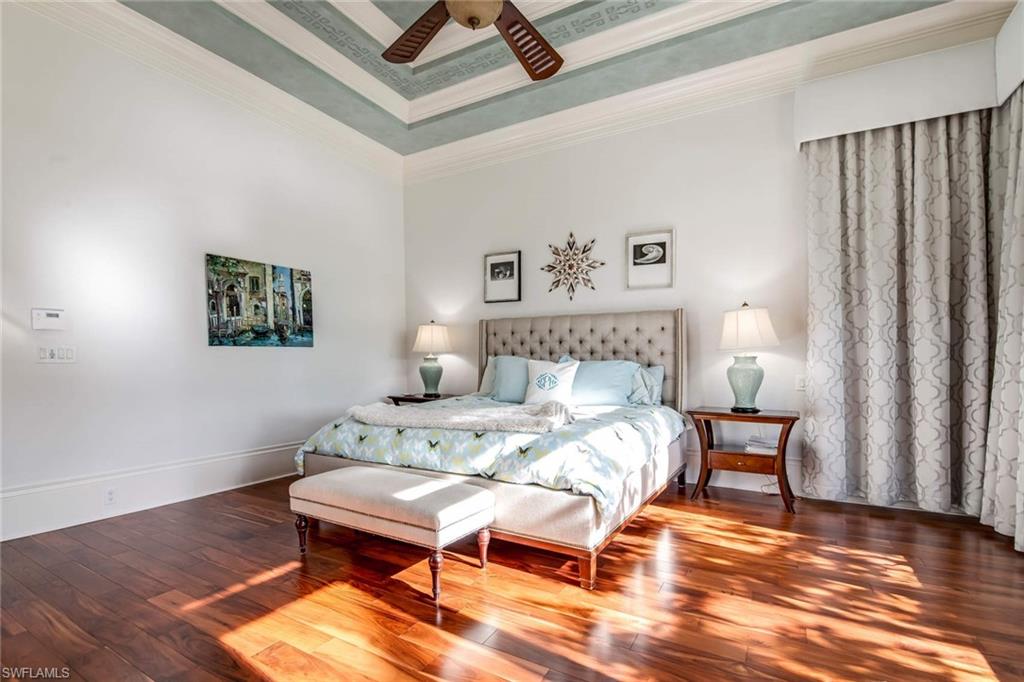 2220 Miramonte Court Naples, FL 34105 - Photo 13 of 35 a bedroom with a bed and wooden floor