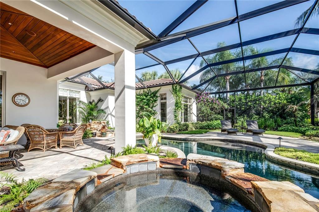 2220 Miramonte Court Naples, FL 34105 - Photo 27 of 35 a view of swimming pool with outdoor seating