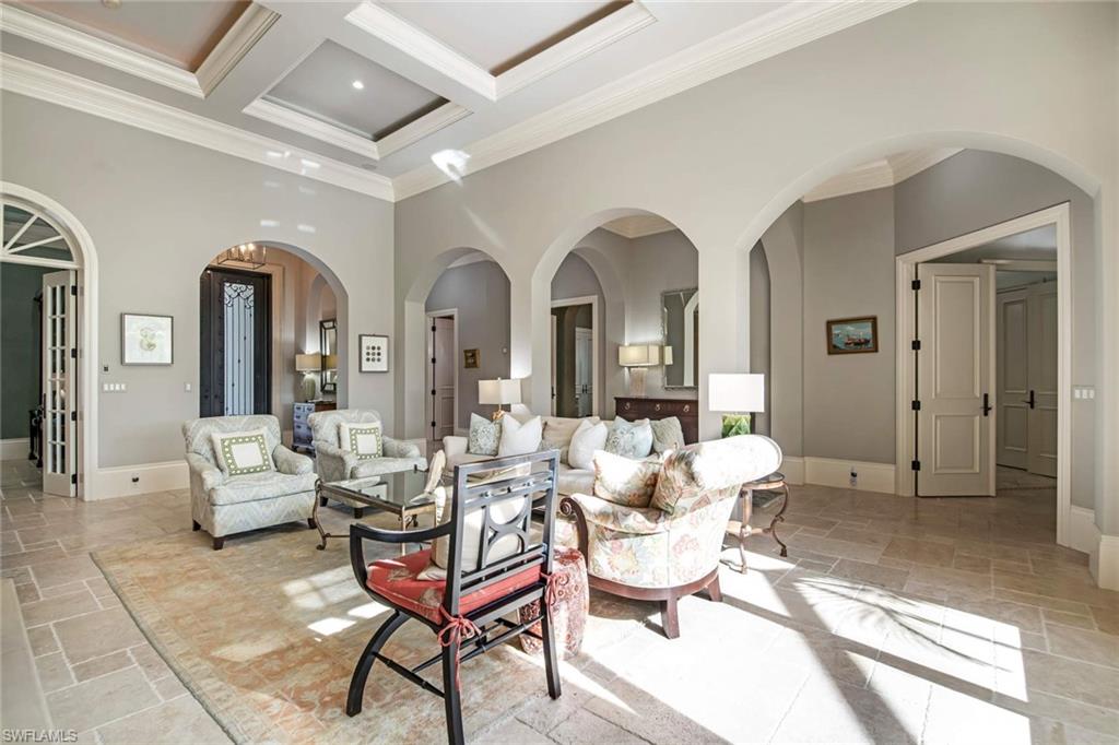 2220 Miramonte Court Naples, FL 34105 - Photo 3 of 35 a living room with patio furniture and white walls