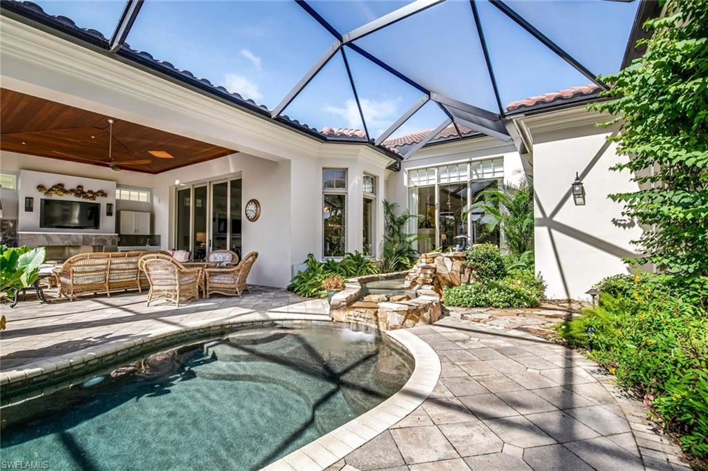 2220 Miramonte Court Naples, FL 34105 - Photo 31 of 35 a house view with pool and outdoor seating