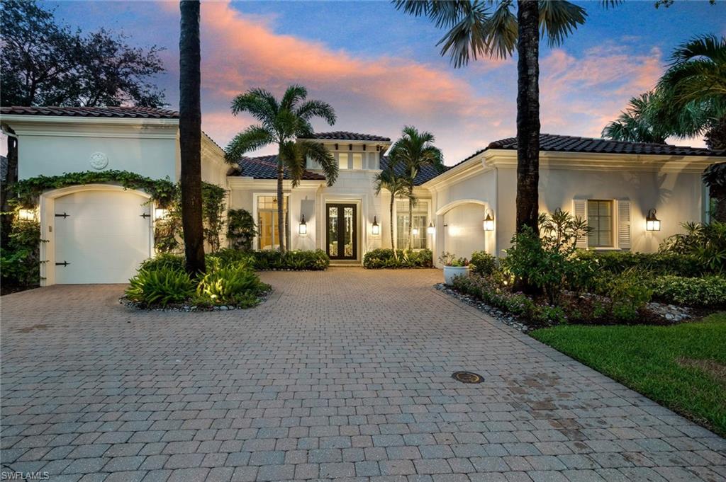 2220 Miramonte Court Naples, FL 34105 - Photo 32 of 35 a front view of a house with a garden