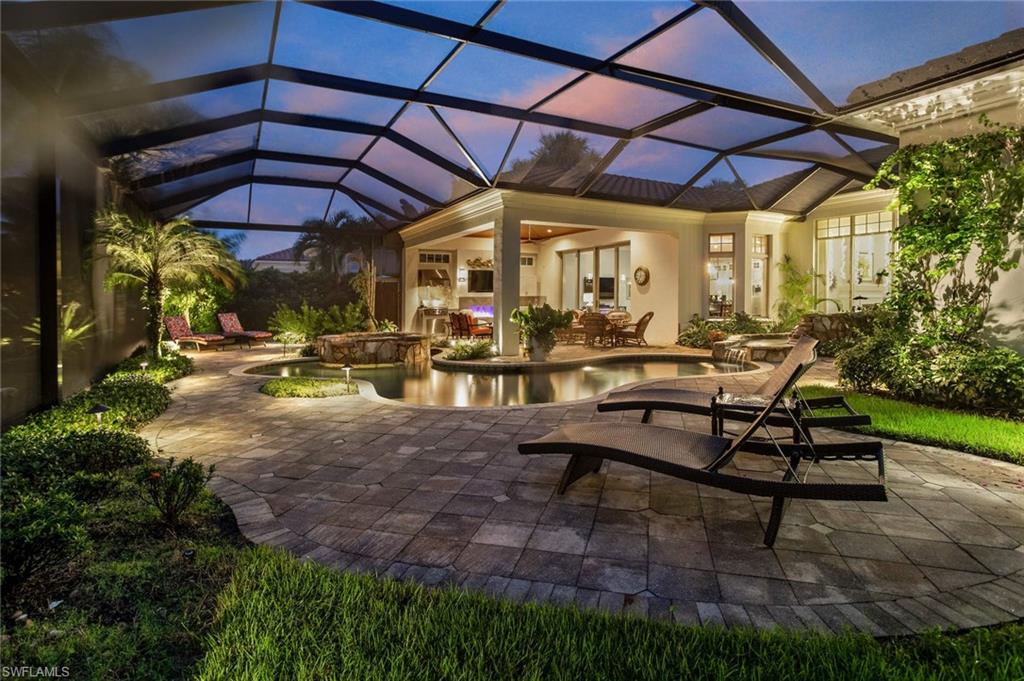 2220 Miramonte Court Naples, FL 34105 - Photo 33 of 35 a view of a backyard with sitting area