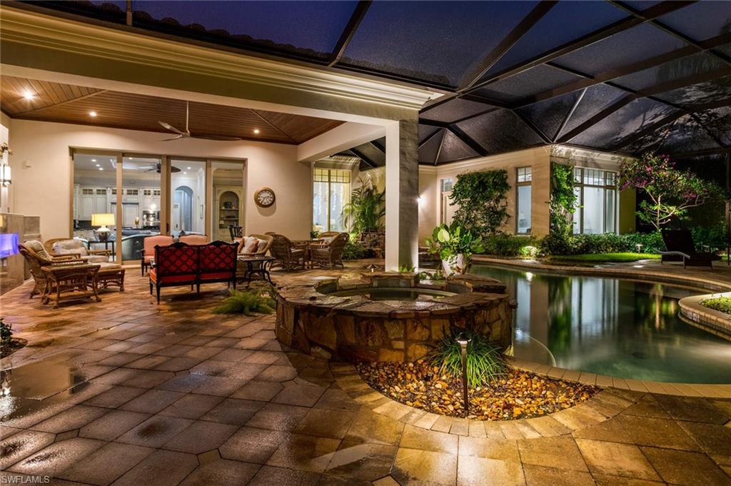 2220 Miramonte Court Naples, FL 34105 - Photo 34 of 35 a view of a swimming pool with outdoor seating