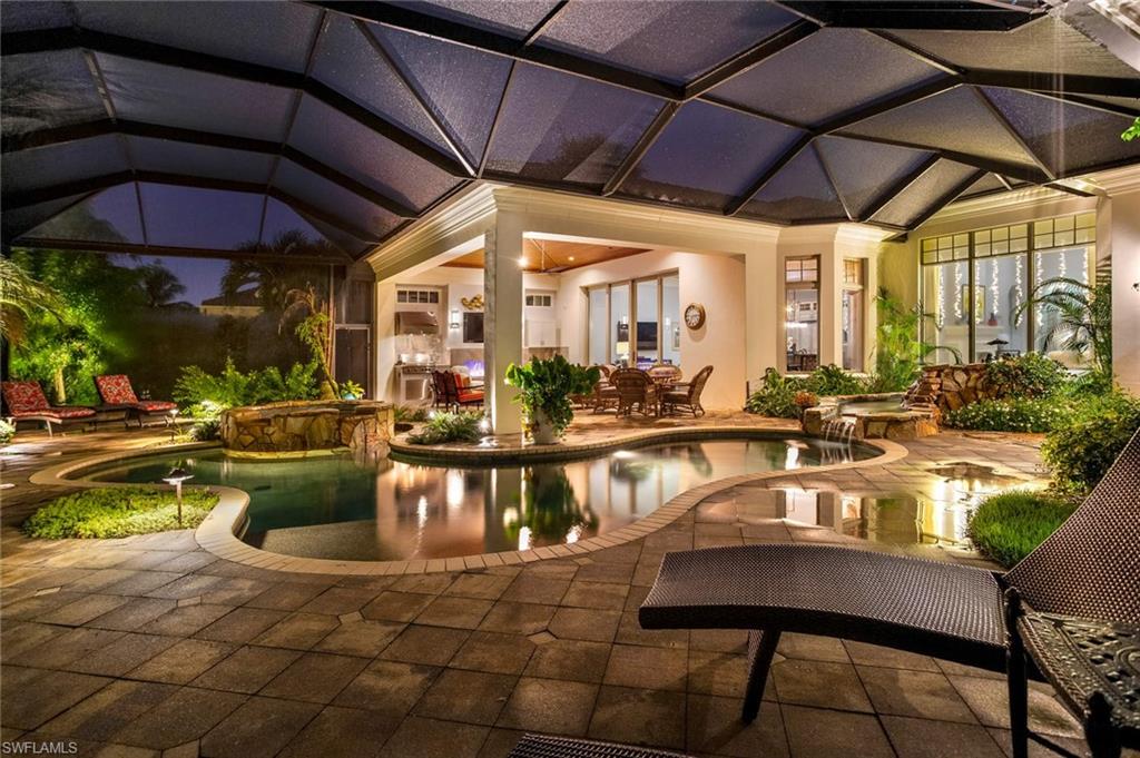 2220 Miramonte Court Naples, FL 34105 - Photo 35 of 35 a view of a swimming pool with outdoor seating