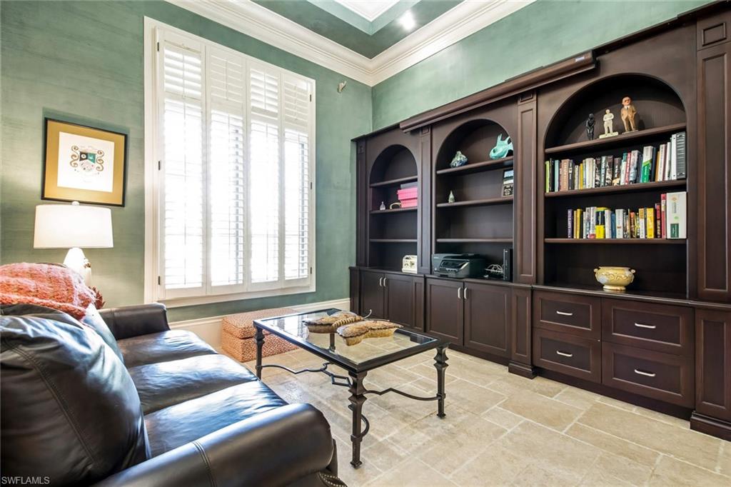 2220 Miramonte Court Naples, FL 34105 - Photo 10 of 35 a living room with furniture a rug and a window
