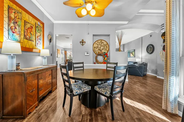 a view of a dining room with furniture and a window