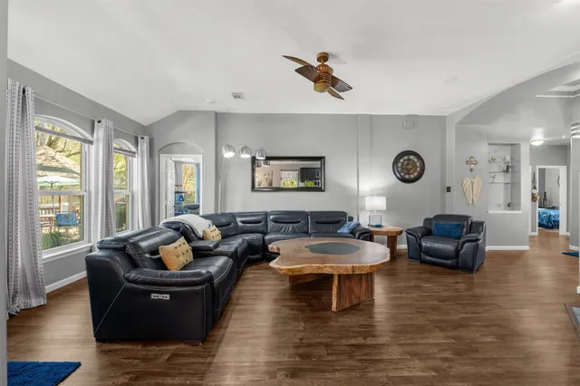 a living room with furniture and a large window