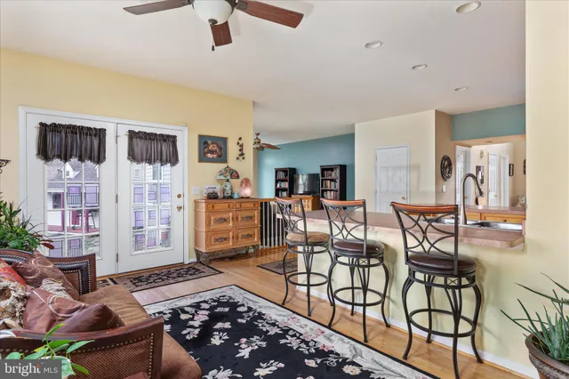 a kitchen with stainless steel appliances granite countertop a refrigerator a stove and a sink with cabinets