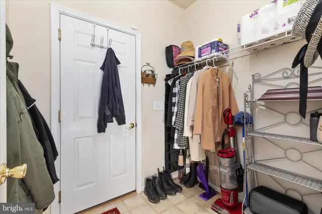 a view of a porch with wooden floor and windows