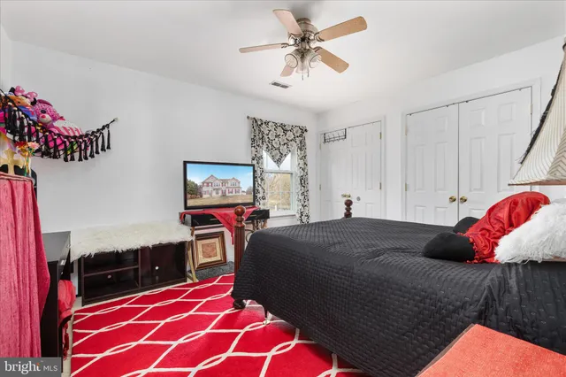a living room with furniture rug and window