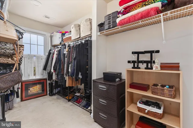 a spacious bathroom with a mirror a double vanity sink and a bathtub