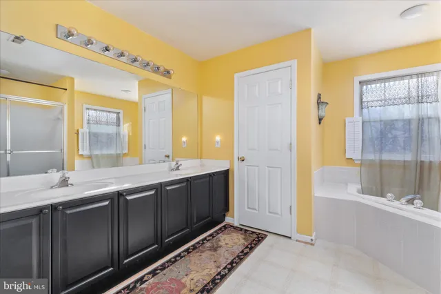 a living room with furniture a table and a potted plant