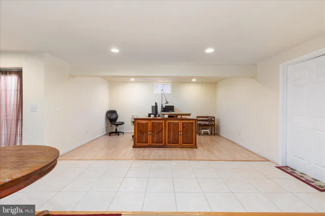 a room with furniture and air hockey table