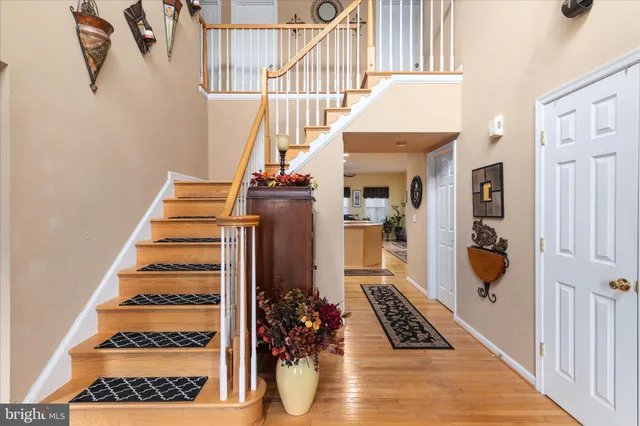 a view of an entryway with wooden floor