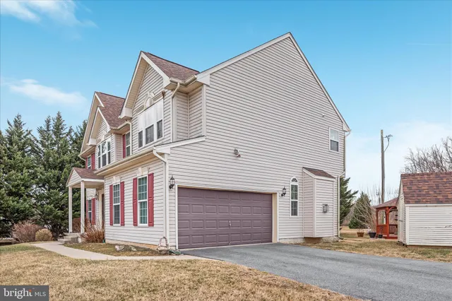 a view of a terrace with a table and chairs