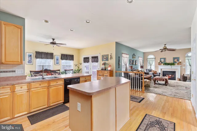 a large kitchen with lots of counter top space and living room