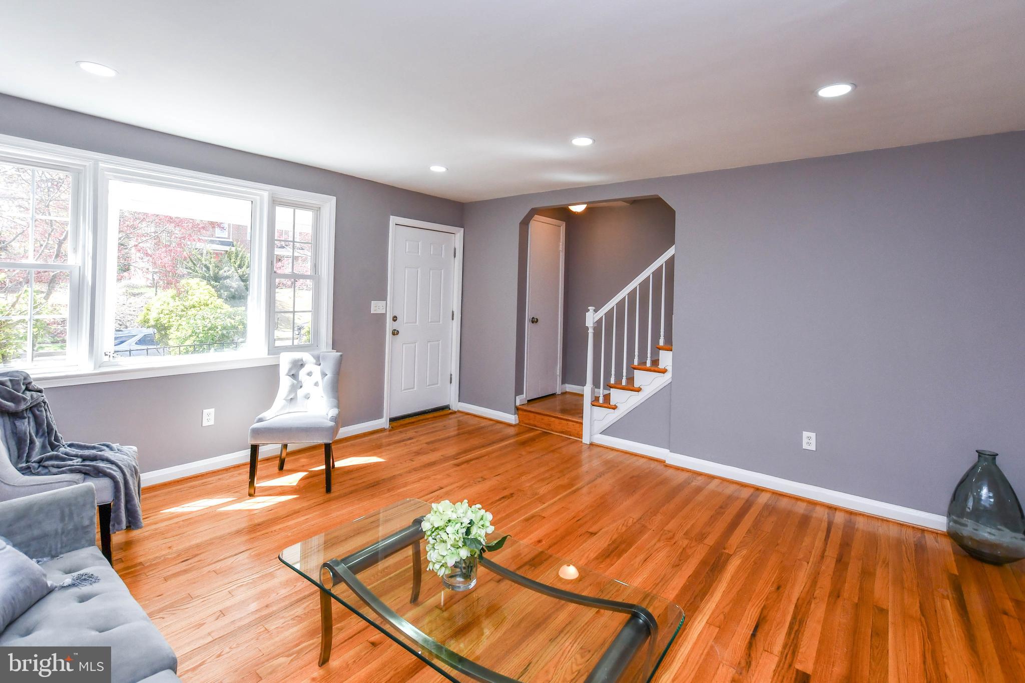 1028 Evesham Avenue Baltimore, MD 21212 - Photo 11 of 49 a view of livingroom with furniture wooden floor and windows