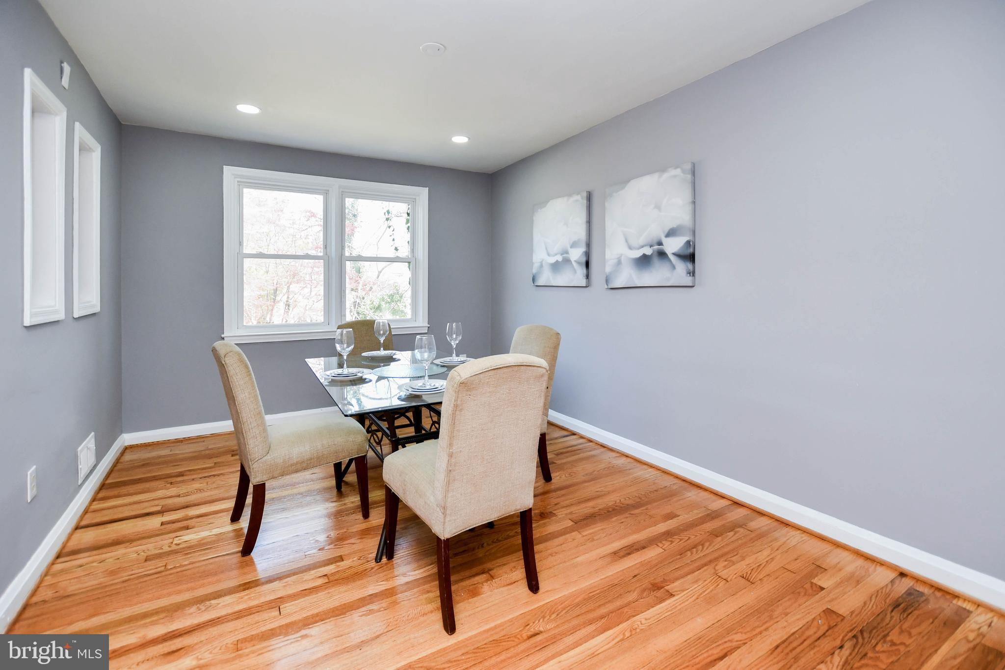 1028 Evesham Avenue Baltimore, MD 21212 - Photo 12 of 49 a view of a dining room with furniture window and wooden floor