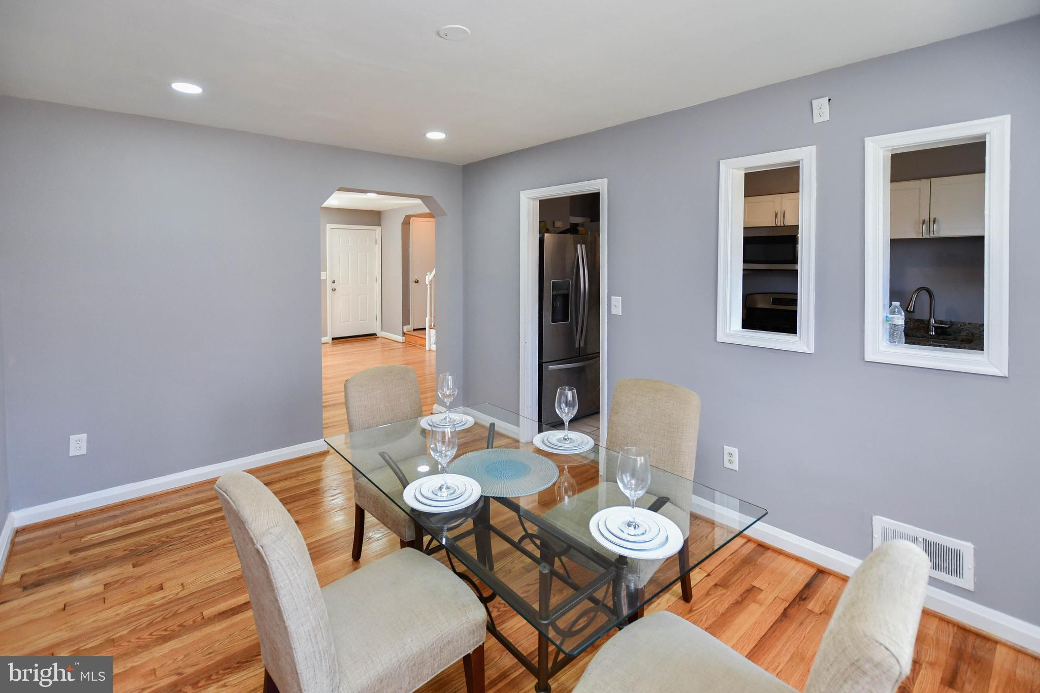 1028 Evesham Avenue Baltimore, MD 21212 - Photo 13 of 49 a view of a dining room with furniture and wooden floor