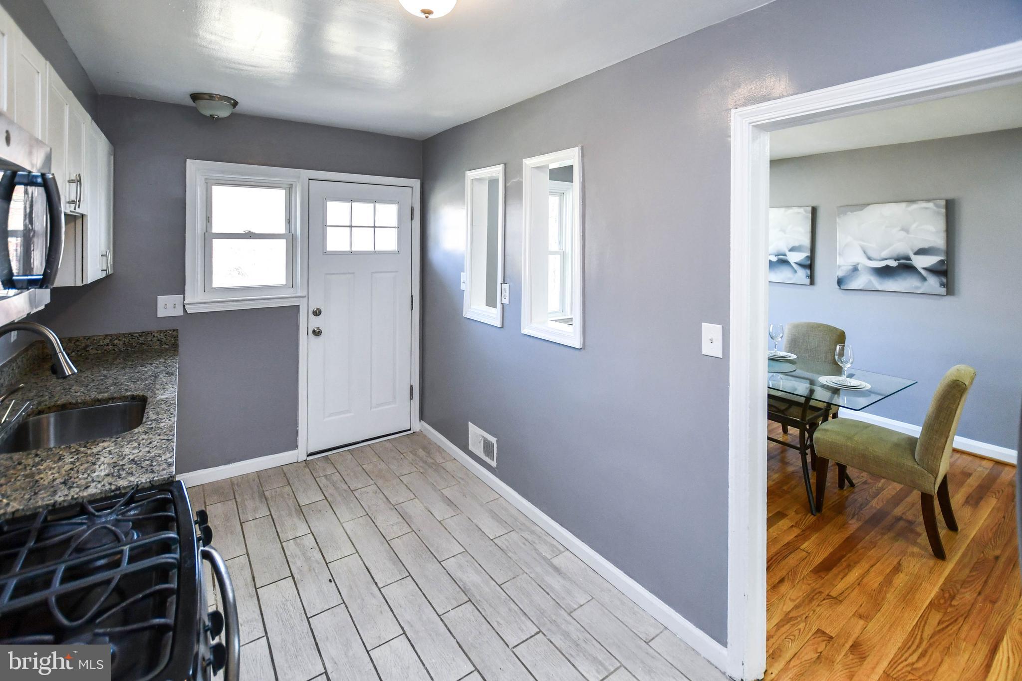 1028 Evesham Avenue Baltimore, MD 21212 - Photo 18 of 49 a view of a livingroom with furniture and a window