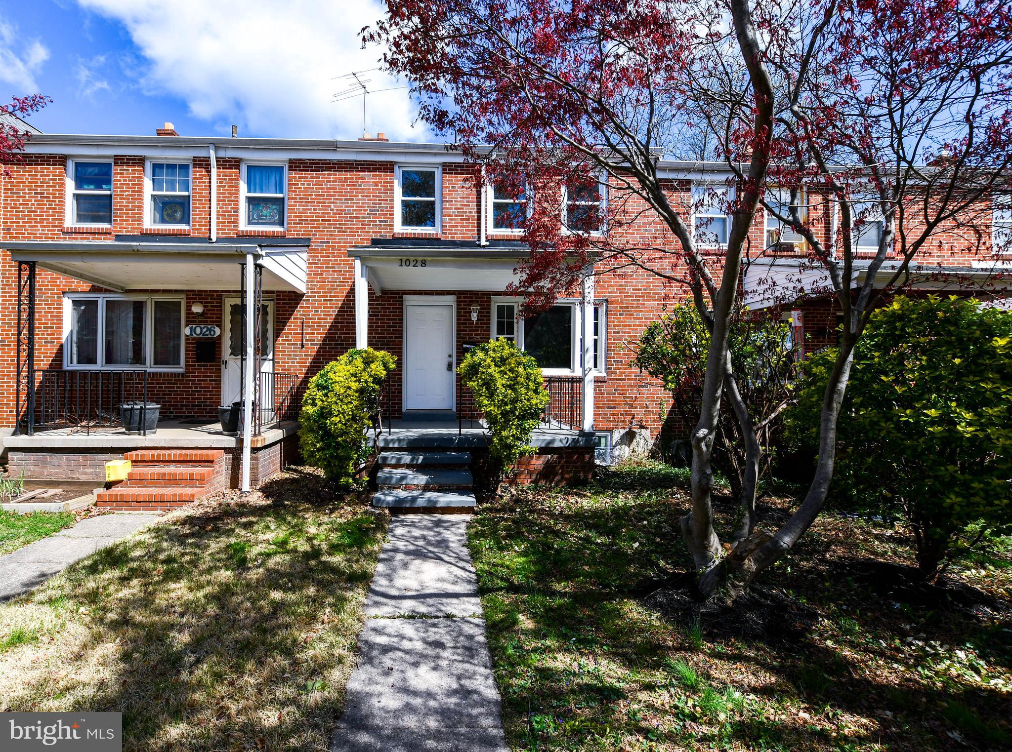 1028 Evesham Avenue Baltimore, MD 21212 - Photo 2 of 49 a front view of a house with garden