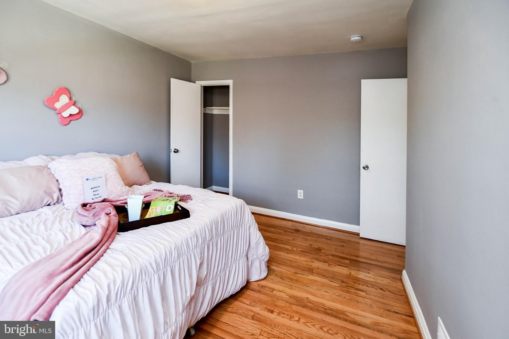 1028 Evesham Avenue Baltimore, MD 21212 - Photo 28 of 49 a bedroom with a bed and painting on the wall