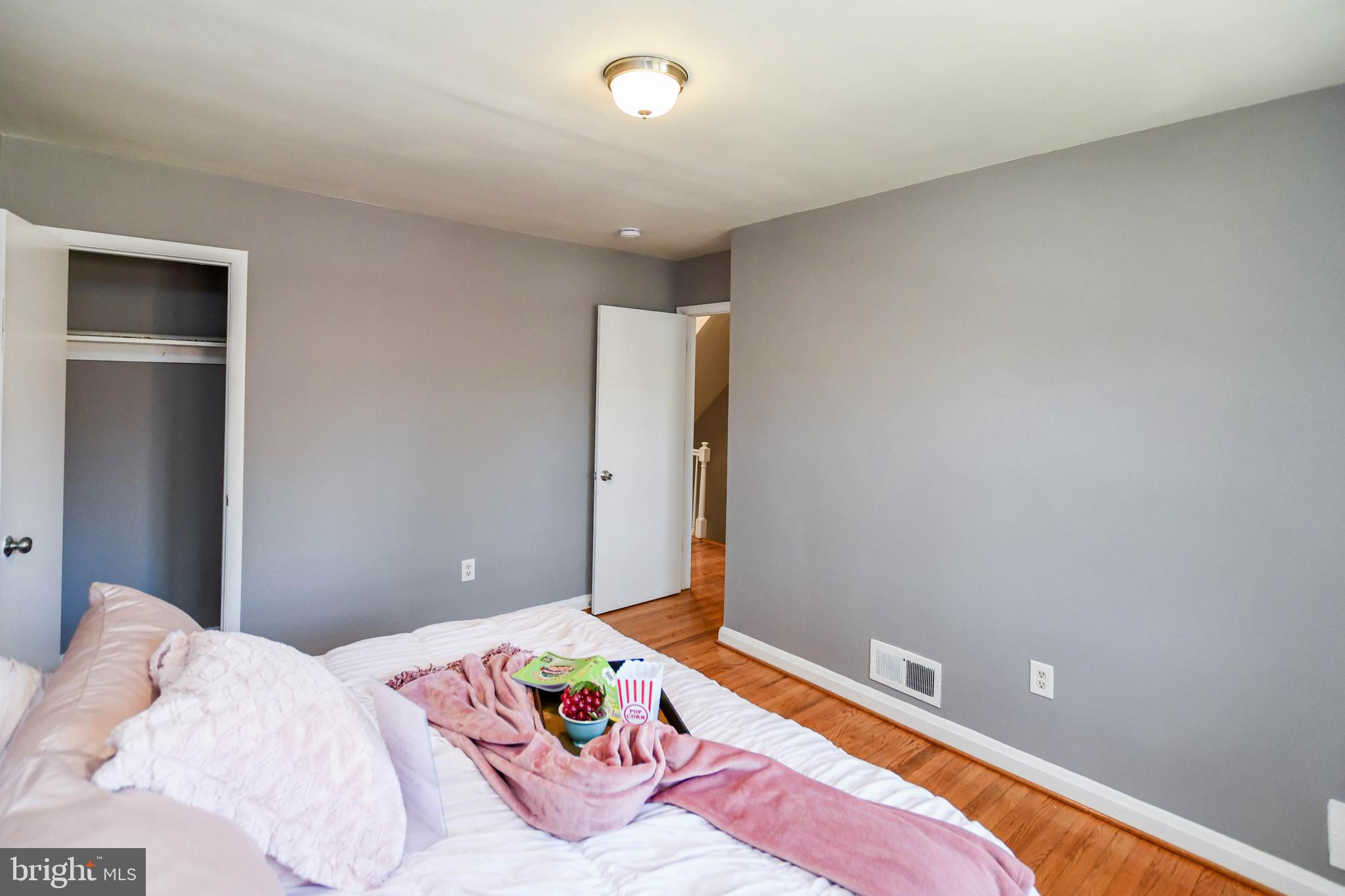 1028 Evesham Avenue Baltimore, MD 21212 - Photo 29 of 49 a bedroom with a bed and a table