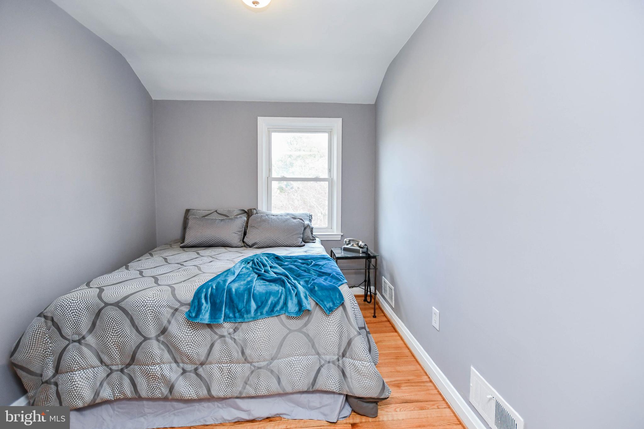 1028 Evesham Avenue Baltimore, MD 21212 - Photo 30 of 49 a bedroom with a bed and a window