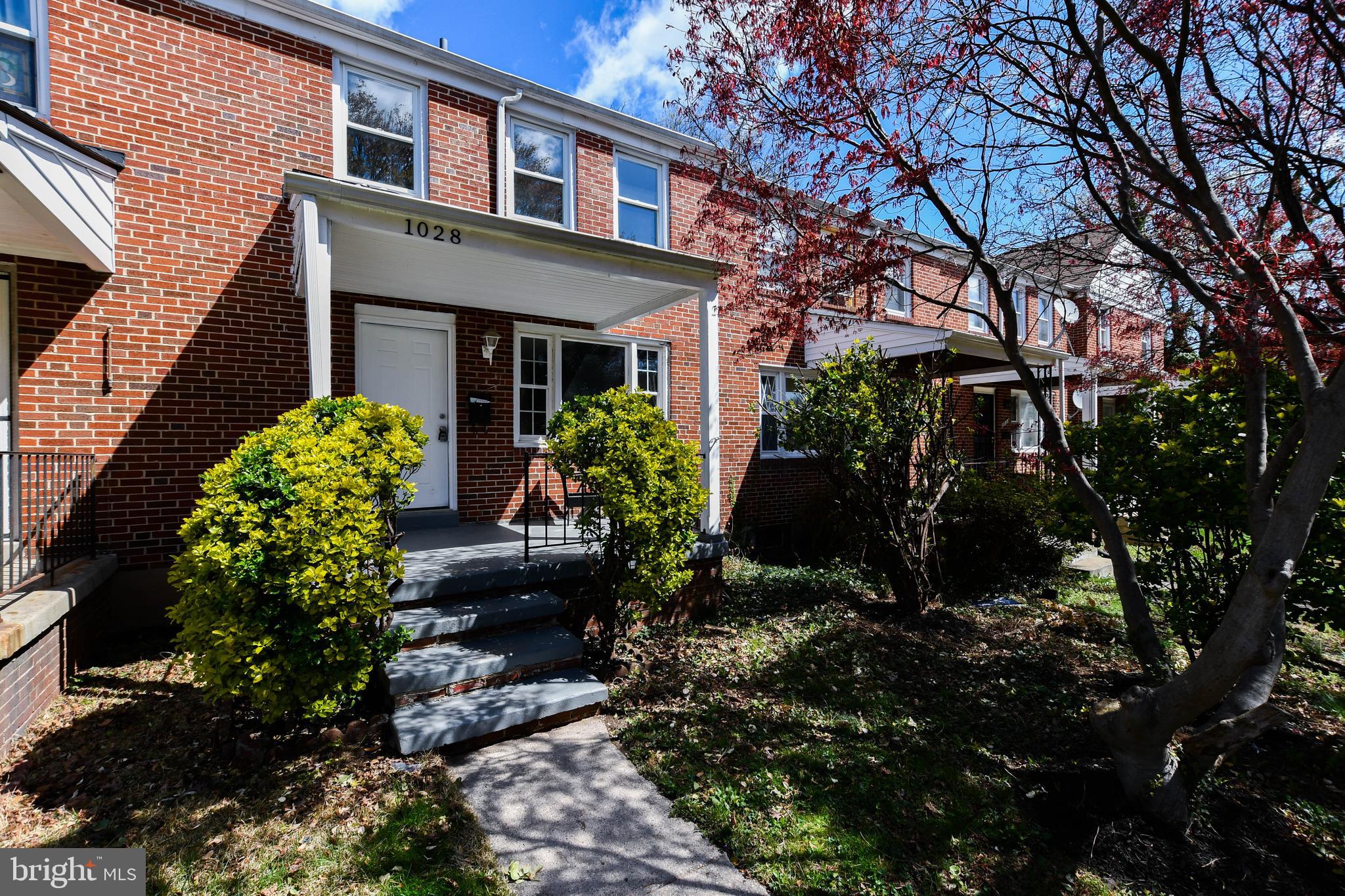 1028 Evesham Avenue Baltimore, MD 21212 - Photo 3 of 49 a front view of a house with garden
