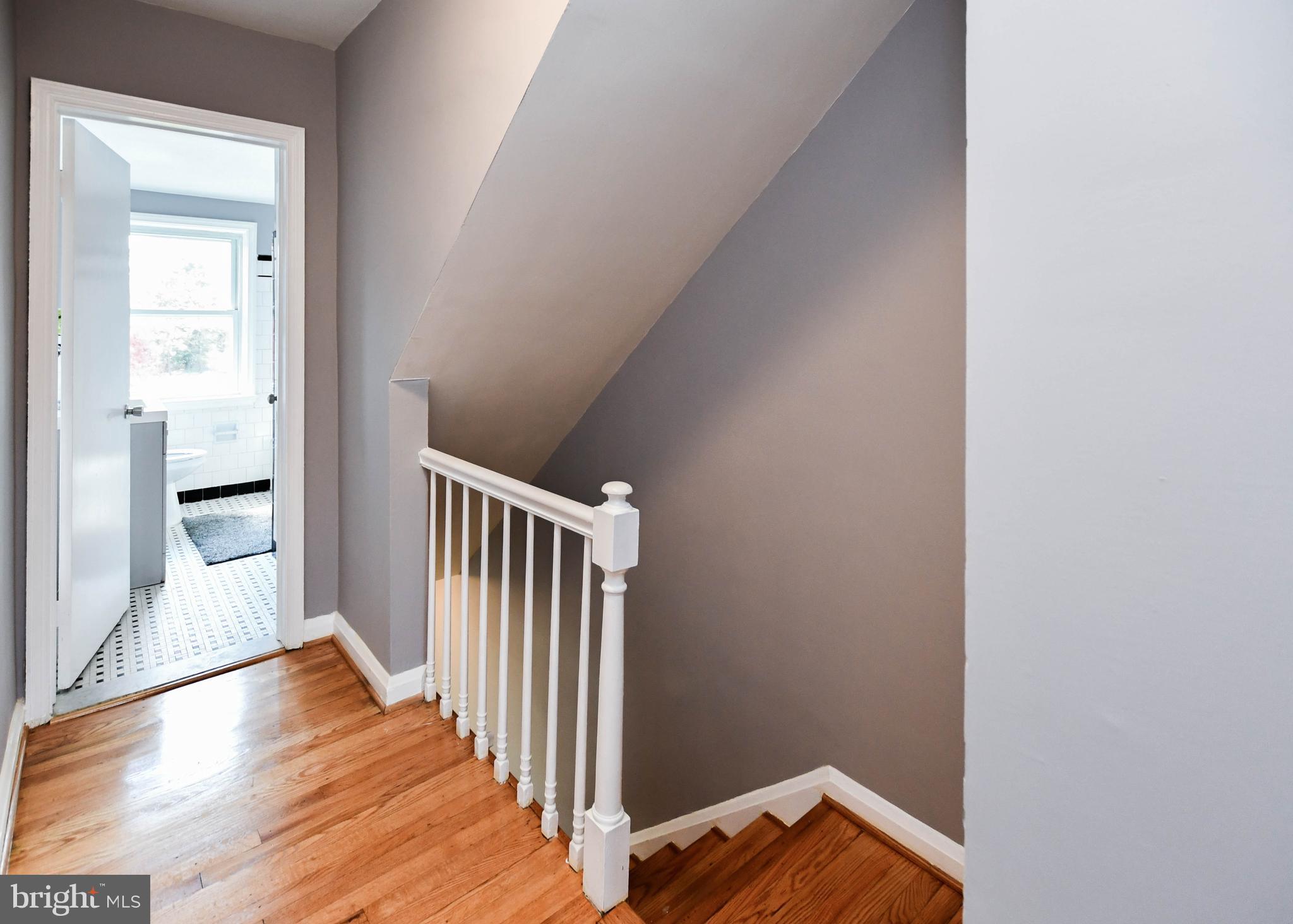 1028 Evesham Avenue Baltimore, MD 21212 - Photo 31 of 49 a view of a hallway with wooden floor and entryway