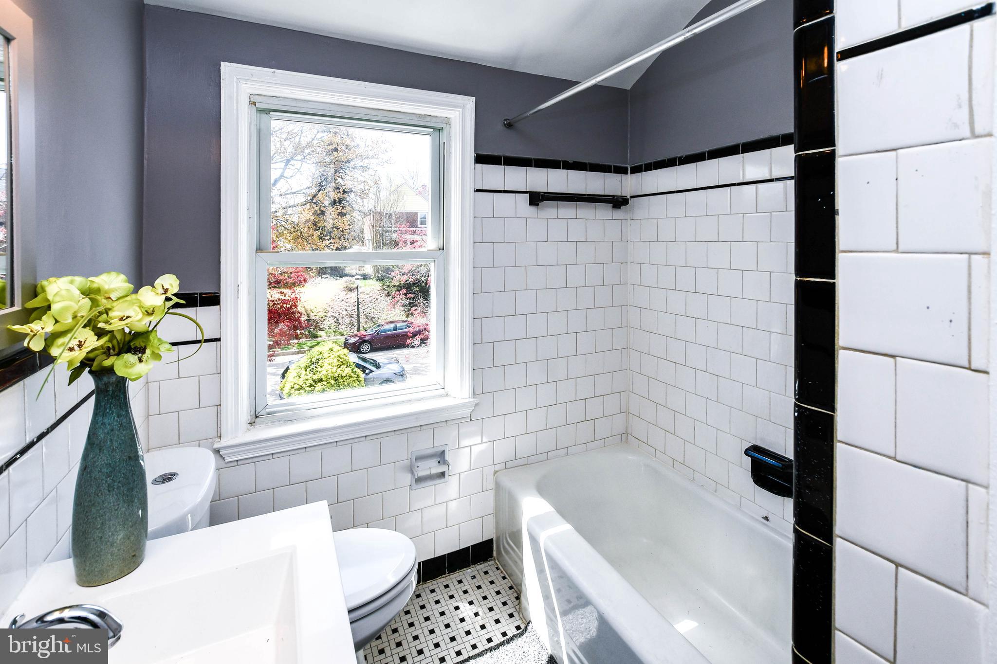 1028 Evesham Avenue Baltimore, MD 21212 - Photo 34 of 49 a bath room with a bathtub and a shower