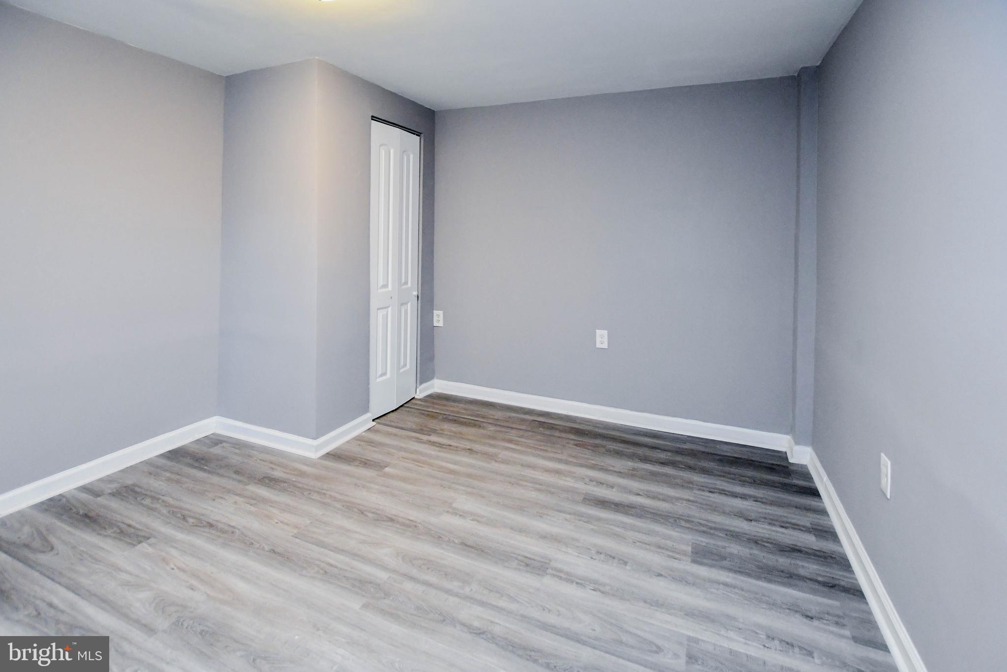 1028 Evesham Avenue Baltimore, MD 21212 - Photo 39 of 49 a view of an empty room with wooden floor