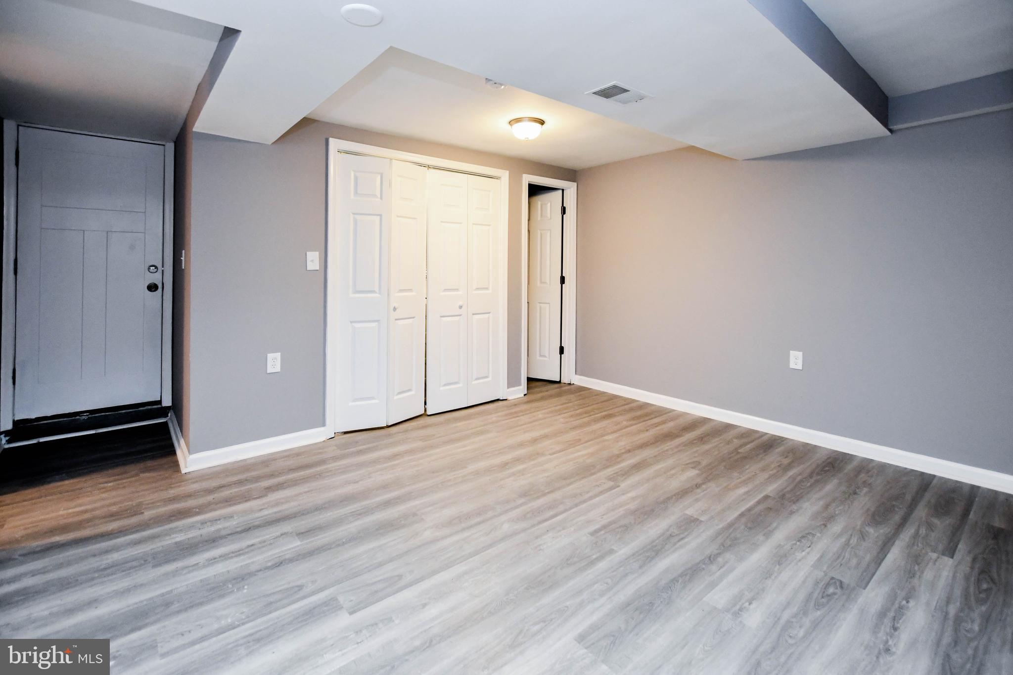 1028 Evesham Avenue Baltimore, MD 21212 - Photo 41 of 49 a view of an empty room with wooden floor