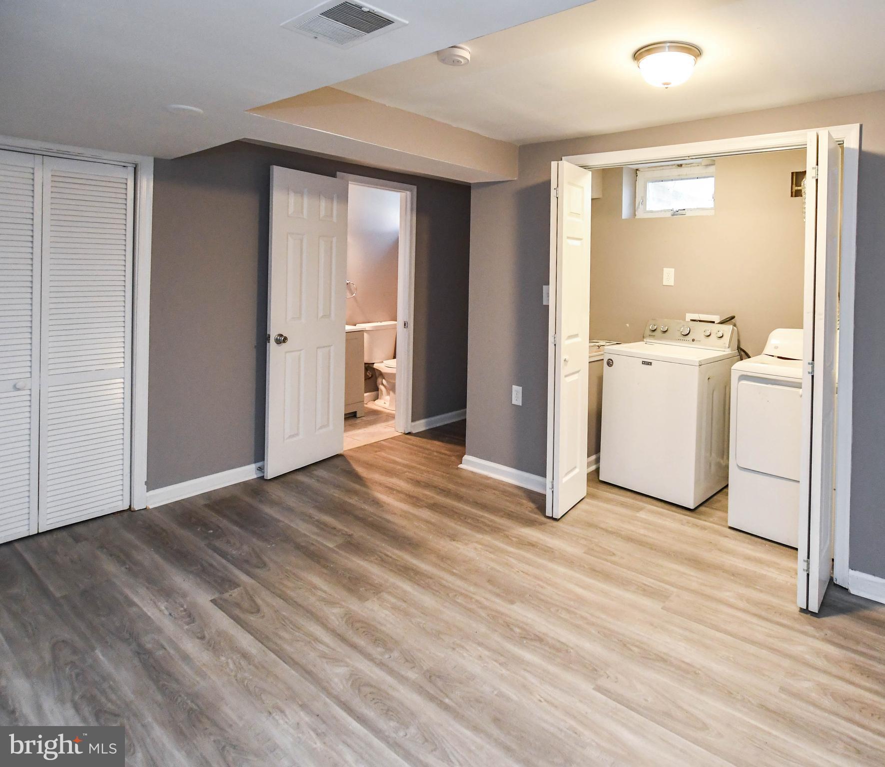 1028 Evesham Avenue Baltimore, MD 21212 - Photo 42 of 49 a view of a room with wooden floor and sink